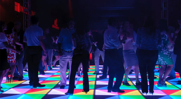 Image: Event attendees dance the night away. Corporate event planning and event management by Benchmarc360.